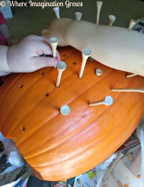 Hammering Nails into Pumpkins with toddlers and preschoolers! Great fine motor work for kids!