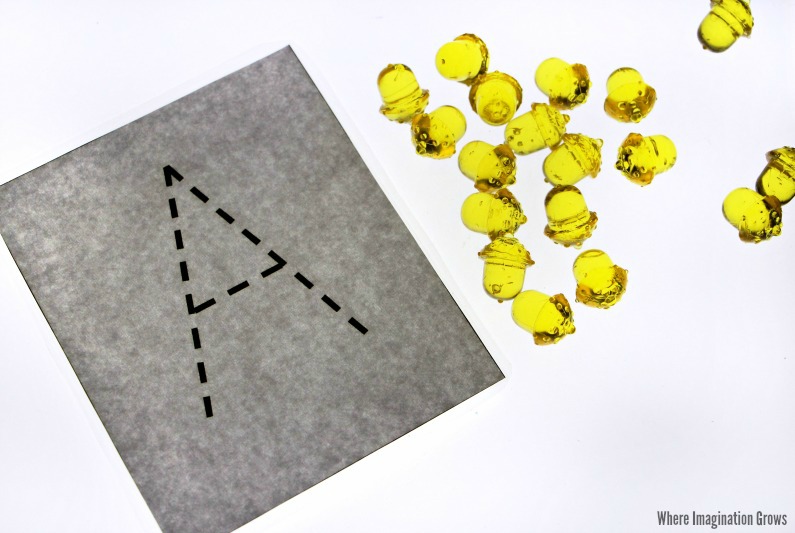 Easy Fall themed alphabet games for the light table! Preschool letter tracing with acorns!