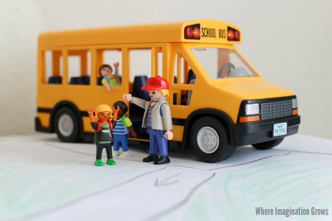Simple school small world play for preschoolers! A hands-on school bus themed pretend play prompt with Playmobil and blocks!